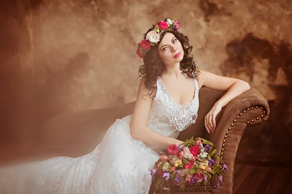 Portrait of beautiful sensual girls brunette in white lace dress