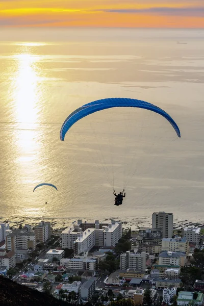Tourist enjoying paraglide jump