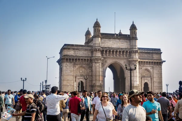 People walking around Indian gateway monument