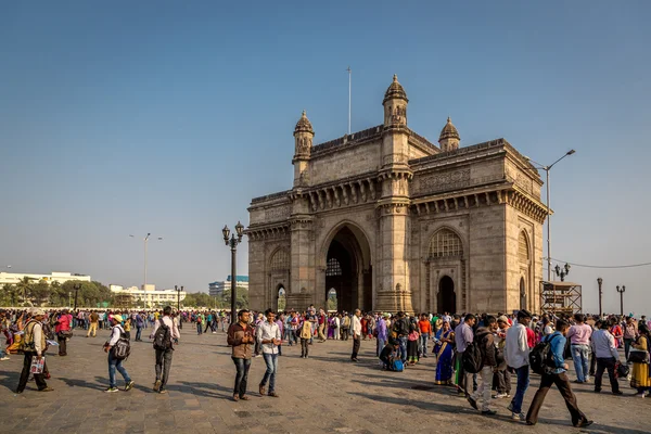 People walking around Indian gateway monument