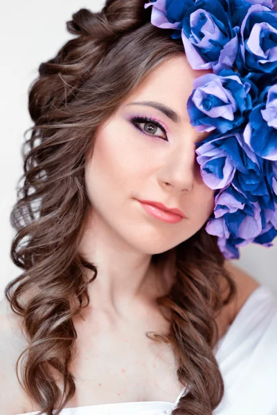 Elegant,fashionable,glamorous and good-looking girl,model with blue wreath.Beautiful,fashionable,glamour,attractive,elegant,sensual girl,woman,princess,lady with blue,flower,wreath,fantasy portrait,art,crown,white,bright face,skin,glamour,creative.