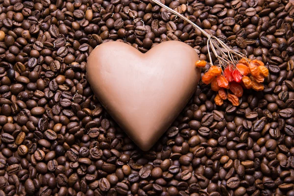 Coffee beans wallpaper with chocolate heart  and viburnum berrie