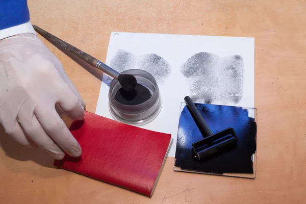 Expert examines the document at the scene