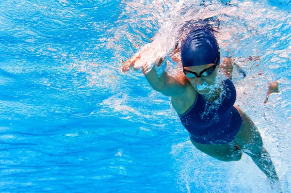Female swimmer in action