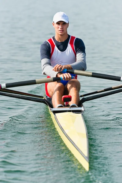 Single scull rowing athlete