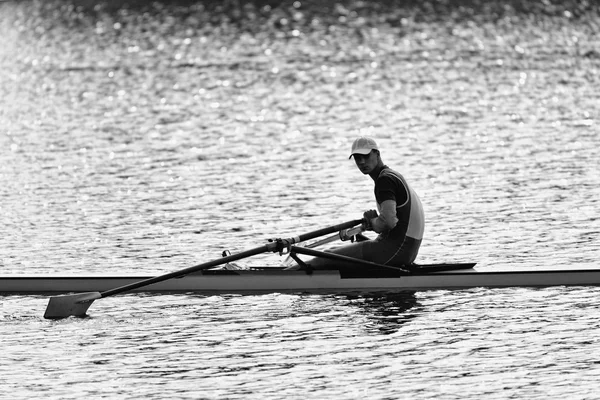 Sportsman resting after rowing