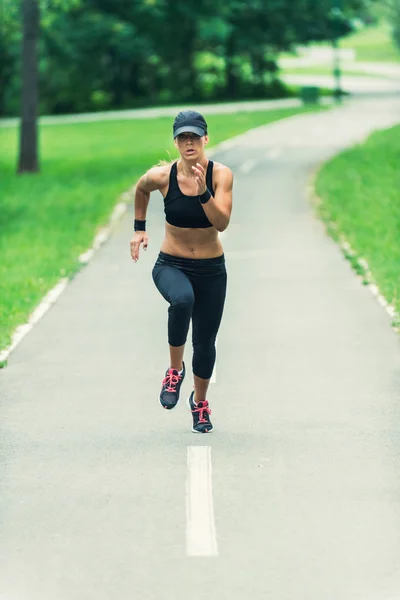 Young woman running in park