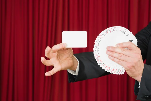 Magician presents blank card