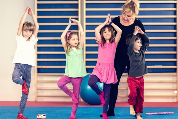 Children with teacher on physical education class