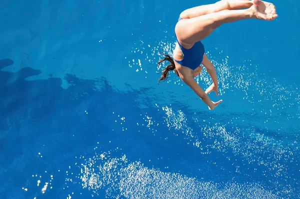Woman diving from high point