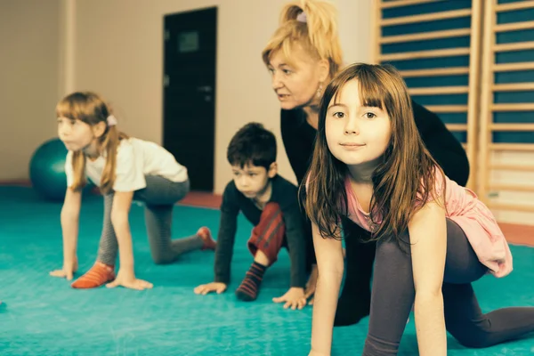 Physical therapist working with children