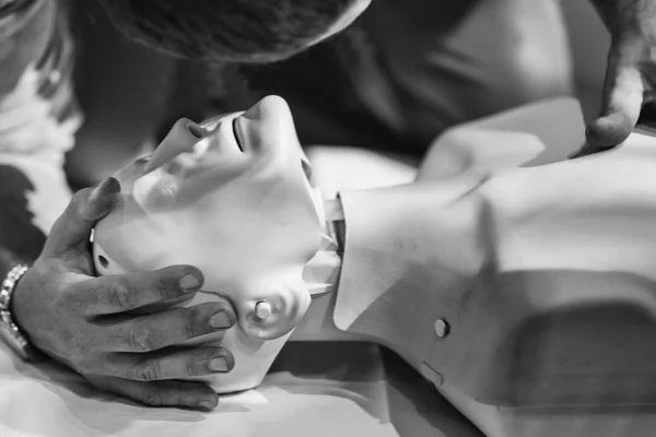 Trainer working with CPR dummy