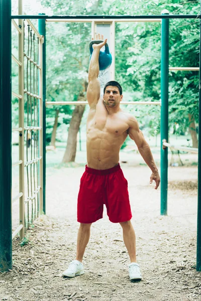 Crossfit athlete with kettle bell