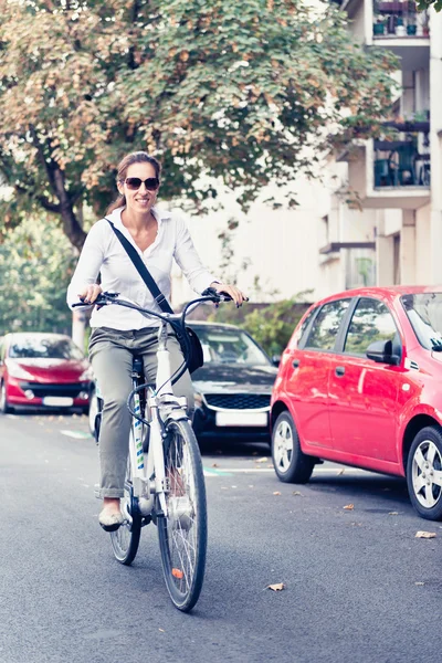Woman using electric bicycle