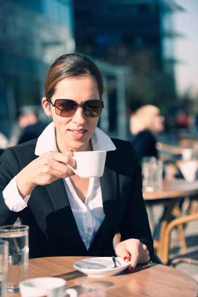 Business woman drinking coffee