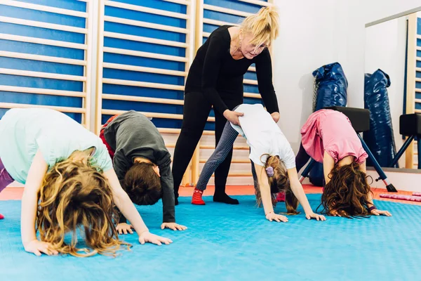 Group of children working with Physical teacher