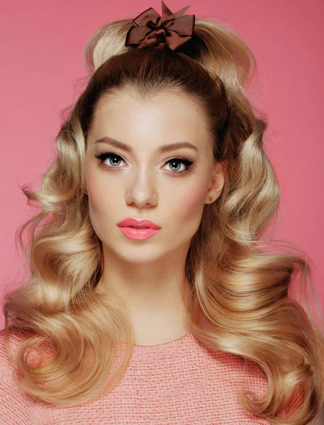 Beautiful Blonde Girl. Healthy Long Curly Hair.Pink dress