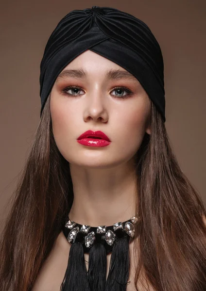 Portrait Beautiful fashion east woman. Indian arabic girl with black turban.