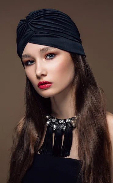 Portrait Beautiful fashion east woman. Indian arabic girl with black turban.