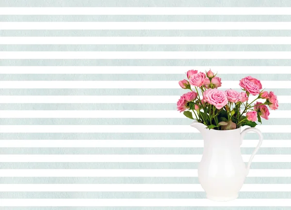 Pink flowers in white jug on watercolor blue stripes background.