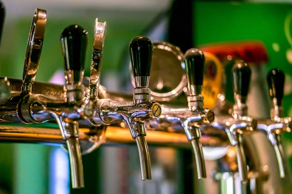 Beer taps in a pub.