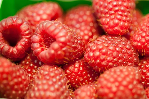 Display of raspberries in bulk for the summer at the fruit shop