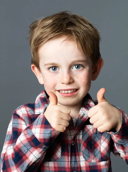 Learning hand gesture for motivated young preschool red hair kid