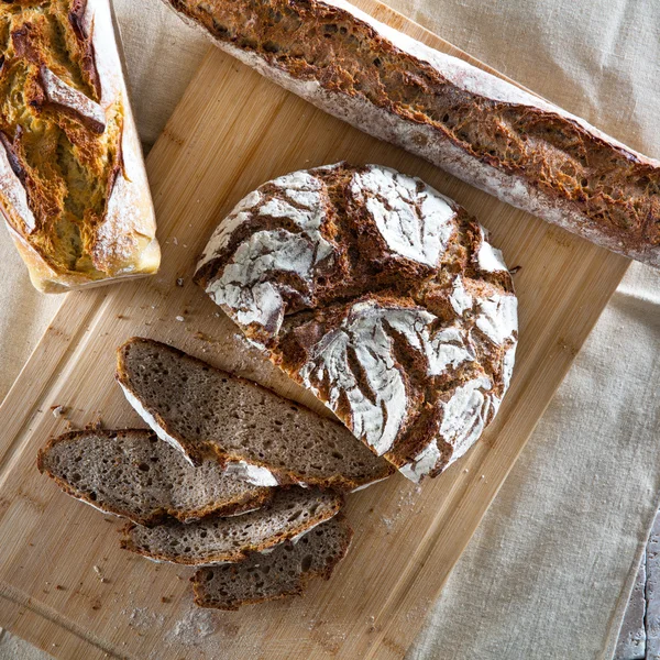 Still-life of organic whole wheat breads with natural materials