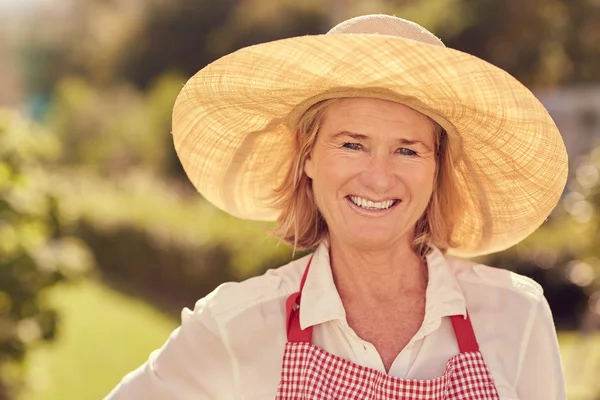 Senior woman in backyard on summer day