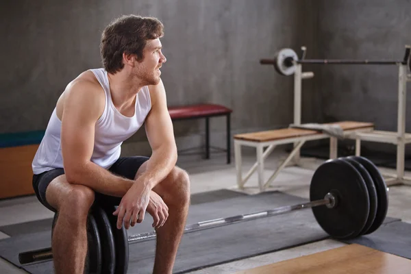 Man looking away in private gym