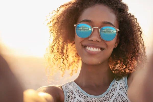 Woman wearing sunglasses at beach