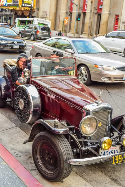 Retro car parked in hollywood boulevard street los angeles california
