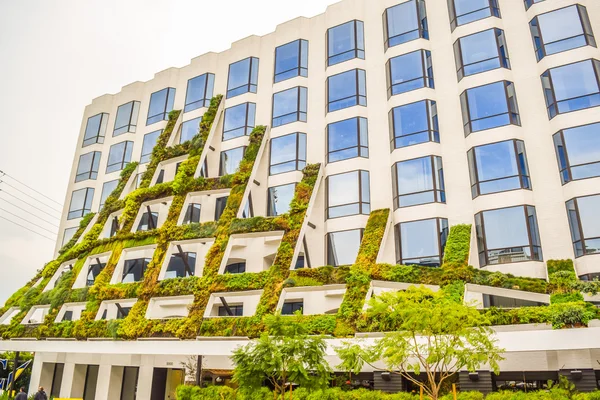 IAC Brings California native plants grace the scuptural facade of 8800 West Sunset Boulevard in West Hollywood