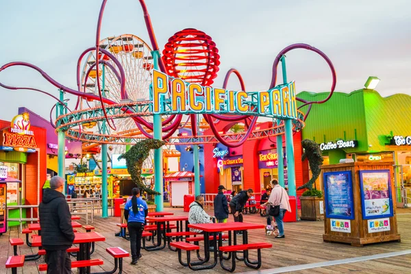The roller coaster at the amusement park on the Santa Monica Pier in Santa Monica 66 sign, California