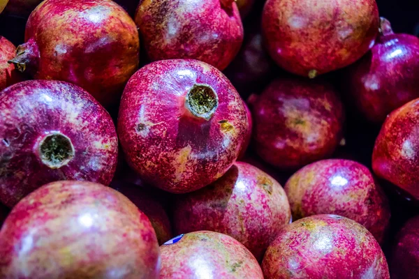 Healthy food, pomegranates background Garnets