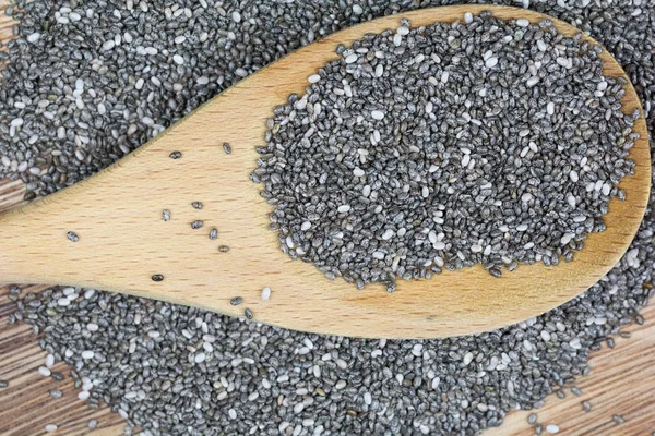 Chia seeds with wooden spoon