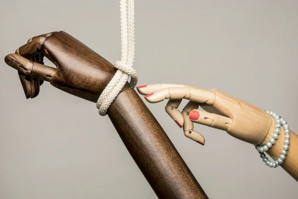 Hand tied black man and woman's hand