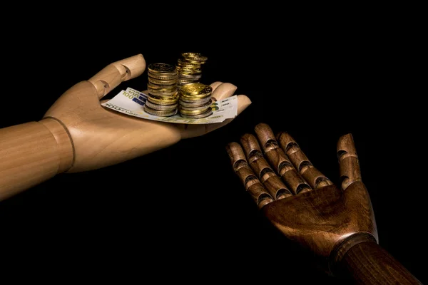 White hand holds money, black hand demand alms.