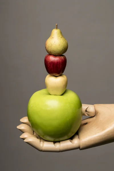 Apple and pear in a hand