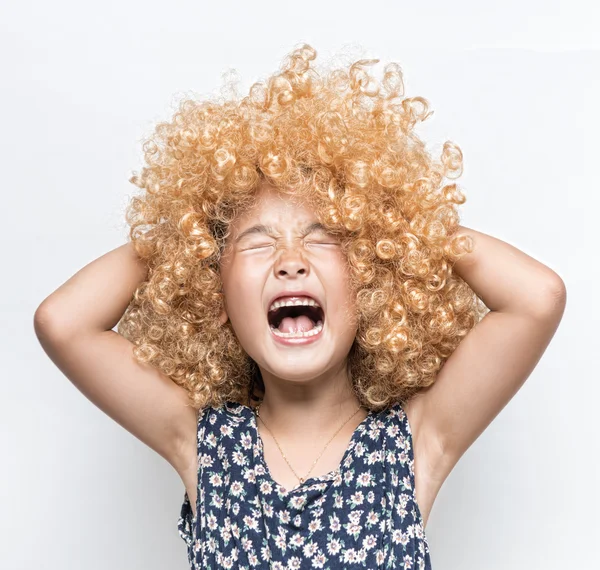 Wearing a blonde wig and funny facial expression Asian girl