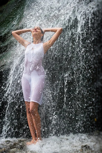 Model shower under waterfall