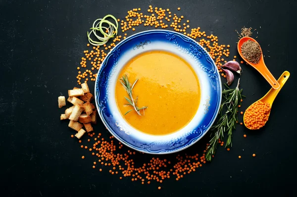Soup of mashed red lentils. Close grain lentils, spices and herbs. Vegetarian concept