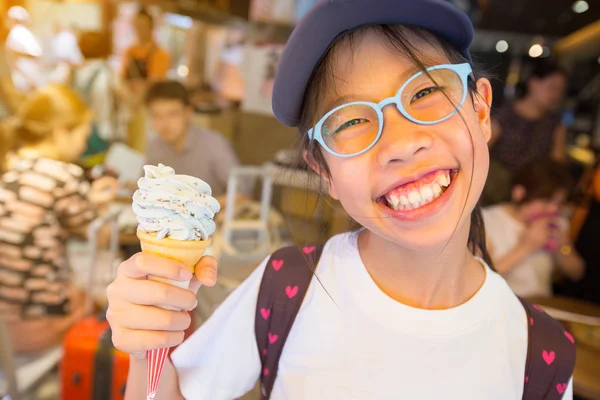 Asian girl enjoying her ice cream