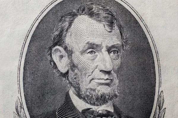 Portrait of US President Abraham Lincoln on the five dollar bill