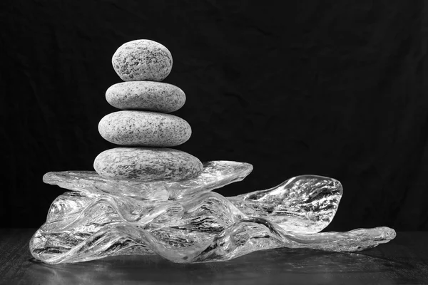 The stones balance on glass. concept of balance and harmony