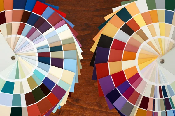 Two color palette guide on the wooden background.