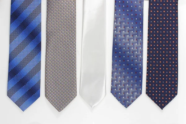 Group of colorful neckties on white