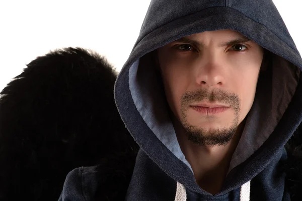 Young man in gray hooded and black wing of right shoulder closeup