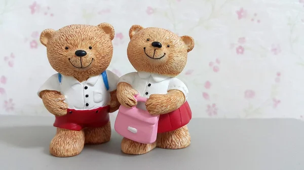 Couple of ceramic bear dolls go to school