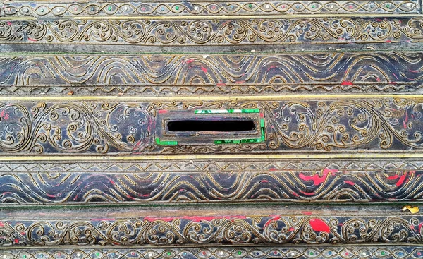 Details of ancient wooden donation box in Thai temple